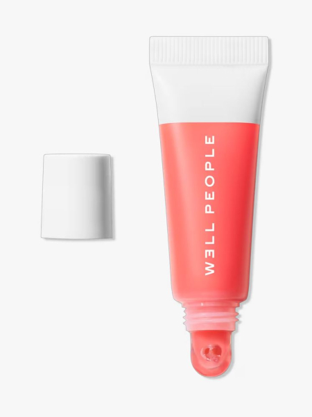 Well People Poutlove Peptide Lip Balm in branded component on a light gray background